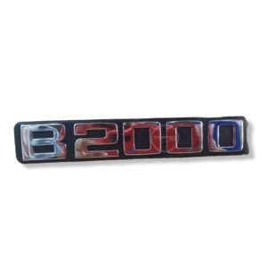 EMBLEMA B2000 "Lateral" (MAZDA B200) Guarda Barros